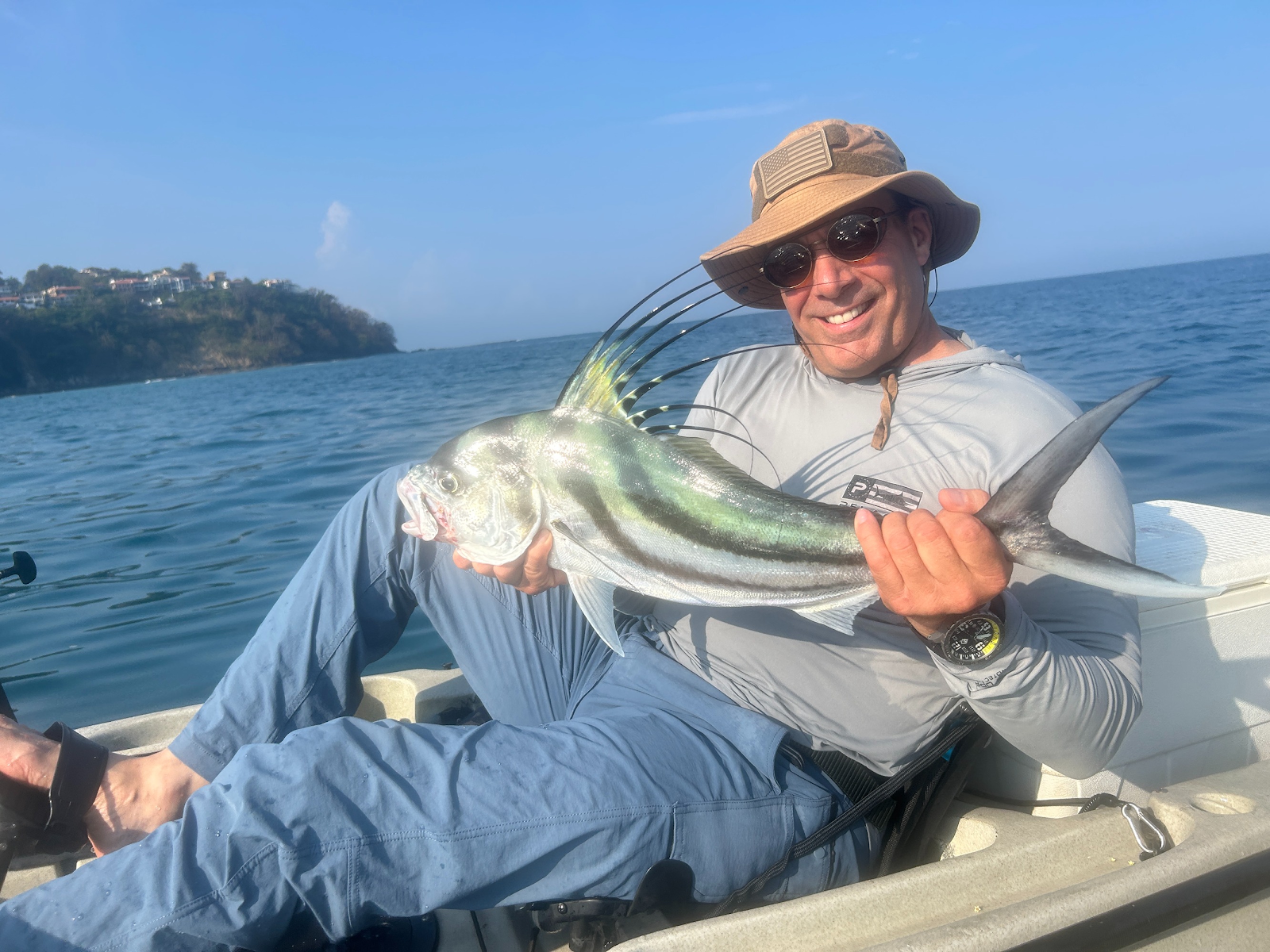 Angler proudly displaying a massive roosterfish