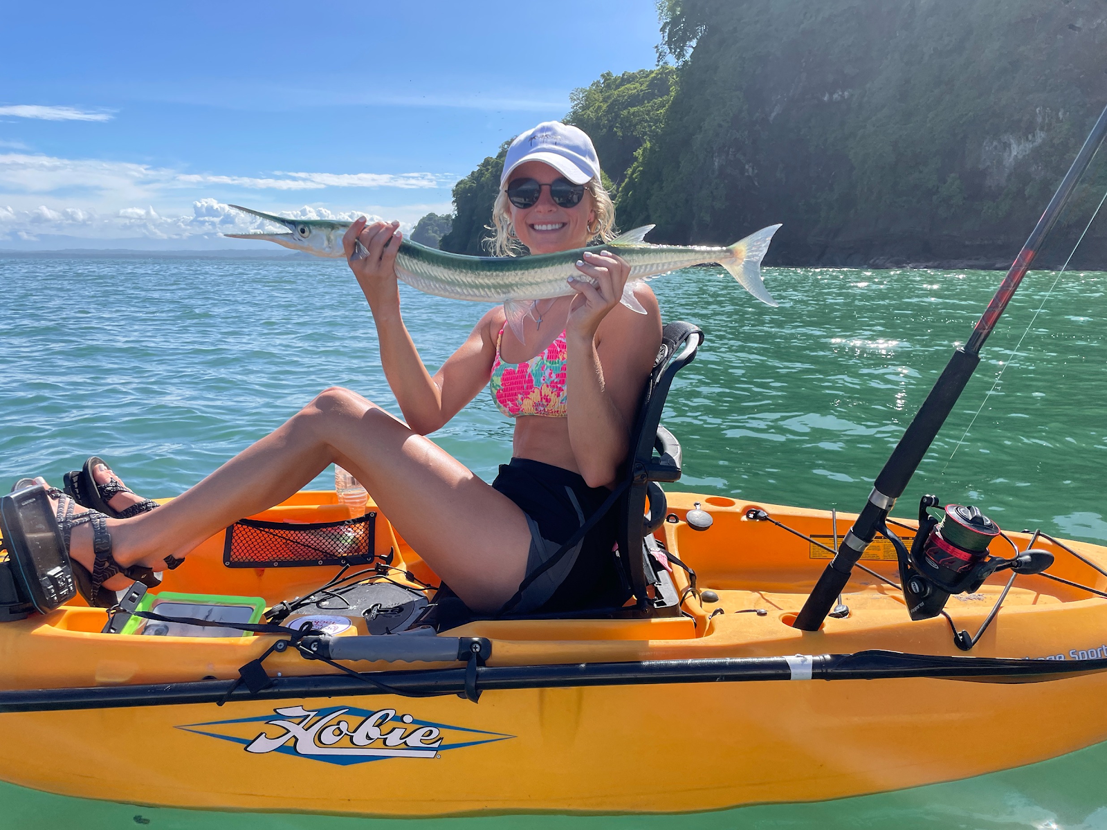 Female angler with a needlefish
