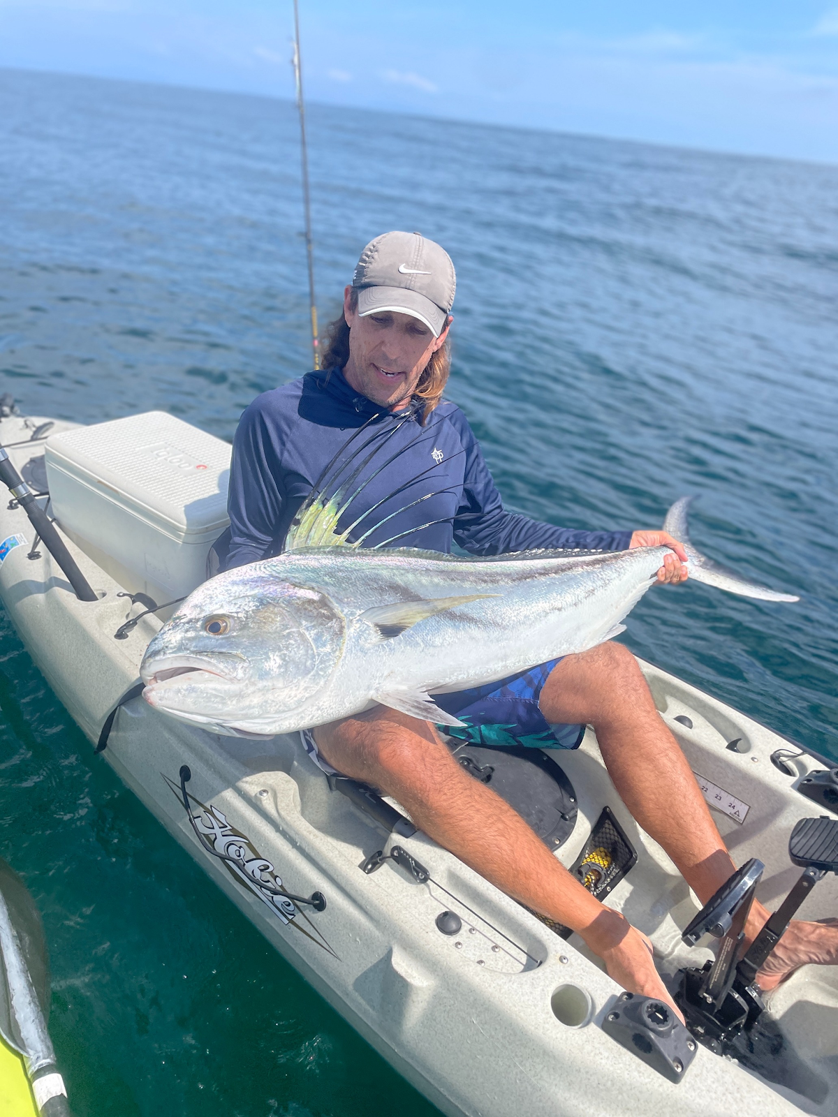 Angler with a large catch on a kayak